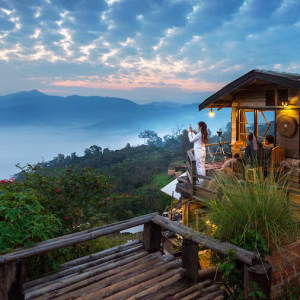 woman-taking-photo-morning-mist-phu-lang-ka-phayao-thailand_335224-950